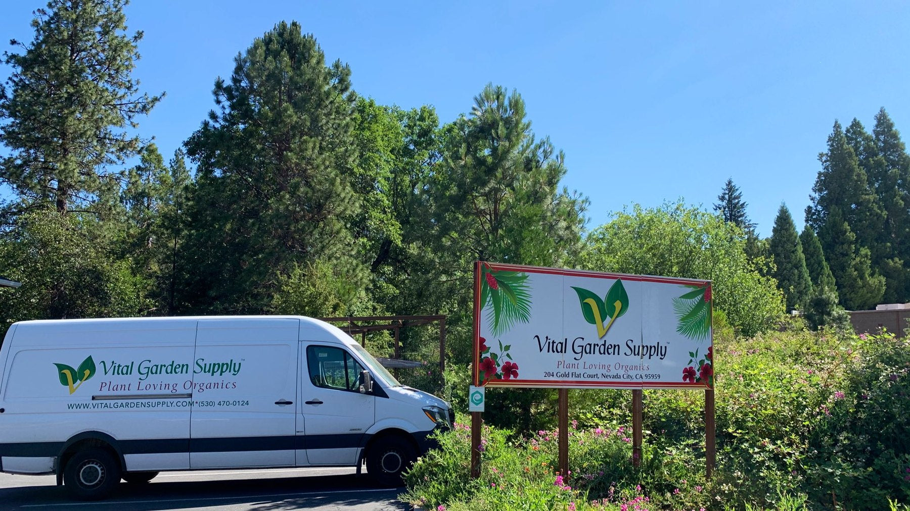 The Vital Garden Supply delivery van beside the roadside sign on Gold Flat Court, Nevada City